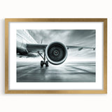 Textured art print of an abstract airplane design in gold and black, framed with a mat, ideal for bedroom decor.