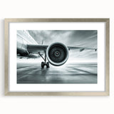 Abstract art print of an airplane in shades of blue and gray on a framed silver mat, ideal for bedroom or dining room decor.