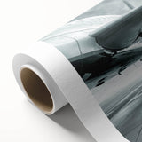 Art deco style airplane illustration on rolled canvas, with muted blue and gray tones, ideal for nursery wall art.