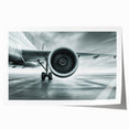 Art deco poster of a vintage airplane in muted gray and blue tones on rolled print, suitable for dining room wall art.