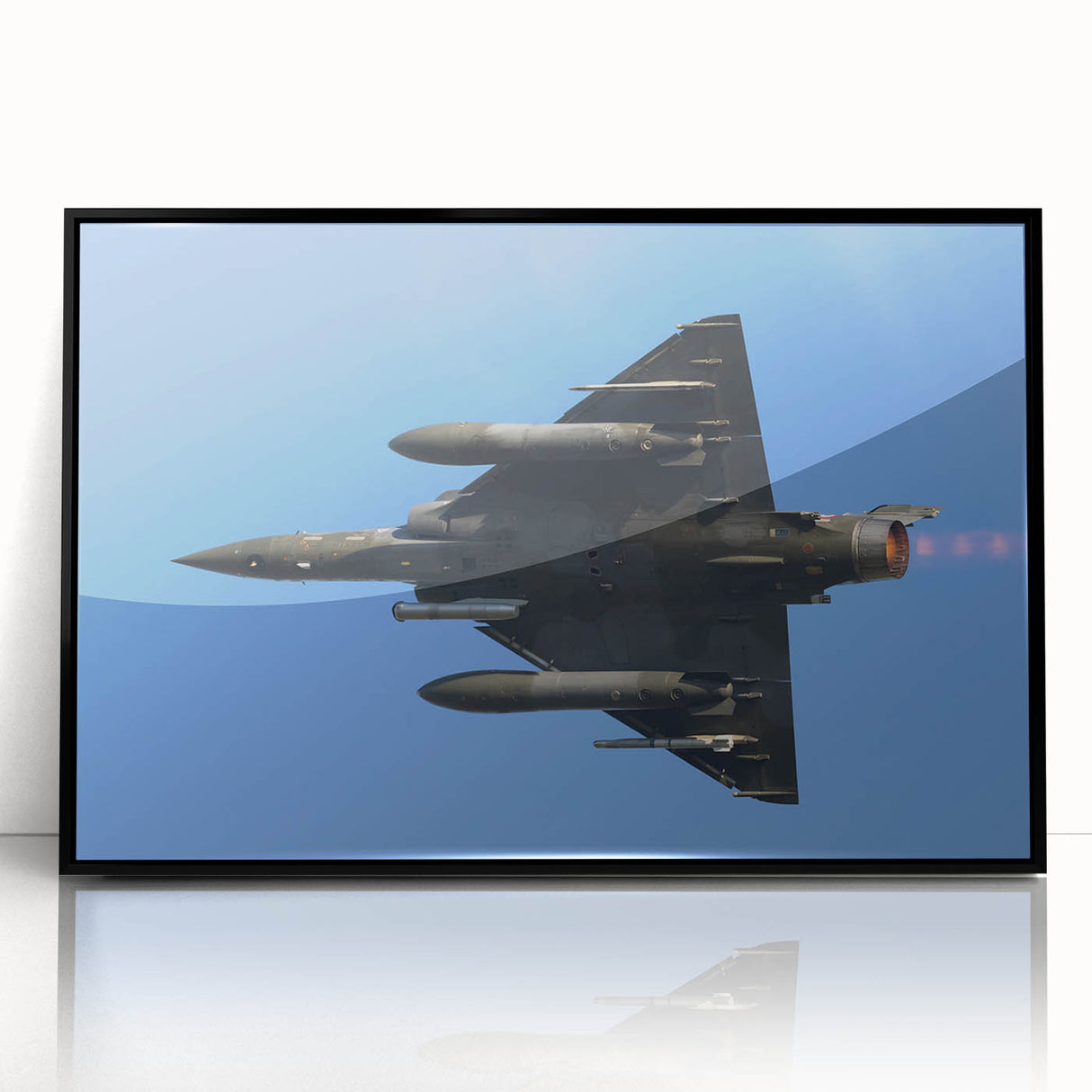 Framed acrylic print of a large abstract airplane design in black and gray, ideal for bedroom or dining room art.