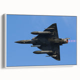 Framed canvas featuring a vintage airplane against a colorful sky, ideal for an office or study.