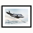 Abstract art print featuring a colorful airplane design on textured canvas, framed in black.