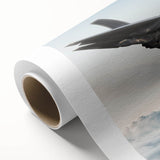 Art deco poster of an airplane in flight, featuring muted gray and blue tones on rolled canvas.