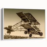 Framed canvas featuring a vintage poster of a black airplane against a colorful sky, ideal for decorating an office.