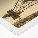 Art deco poster of a vintage airplane in muted silver and blue tones on rolled canvas, suitable for art wall dining room.