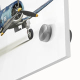 Large abstract wall art of airplanes in muted gray and blue tones on acrylic glass.