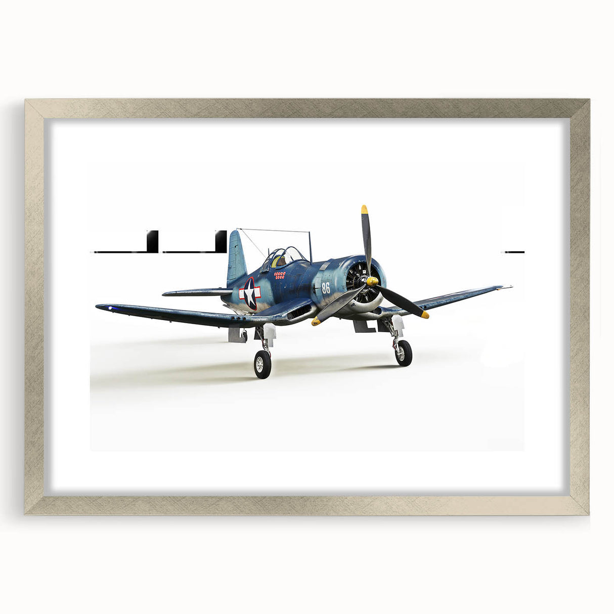 Abstract art print of airplanes in muted gray and silver tones, framed with a silver mat.