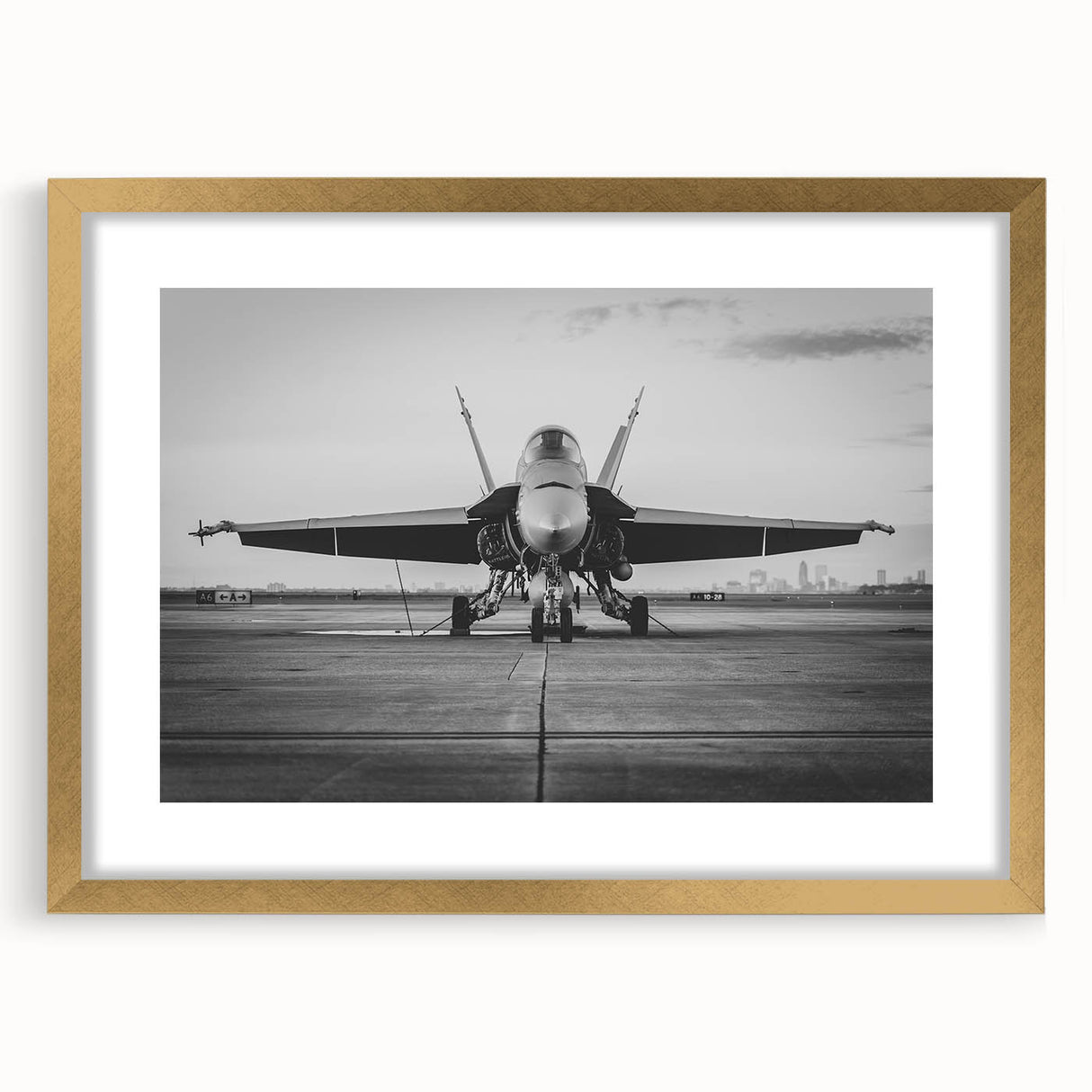Abstract airplane design in gold and black, acrylic print, suited for modern bedroom or dining room decor.