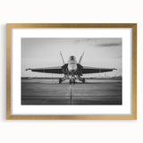 Abstract airplane design in gold and black, acrylic print, suited for modern bedroom or dining room decor.
