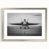 Textured art print of abstract airplanes in muted gray and blue tones on a silver-framed mat.