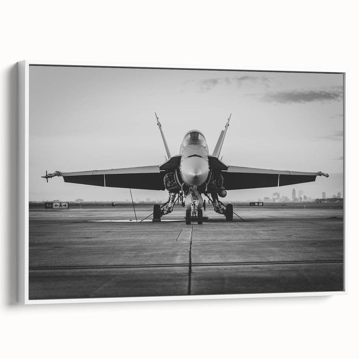 Vintage poster art of a classic airplane in black and colorful tones on a framed canvas.