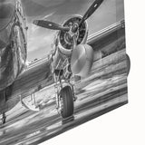 Large abstract wall art featuring an airplane design in muted gray and blue tones on acrylic glass.