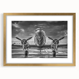 Abstract art print of a stylized airplane in gold and black, framed with a mat, suitable for bedroom or dining room decor.