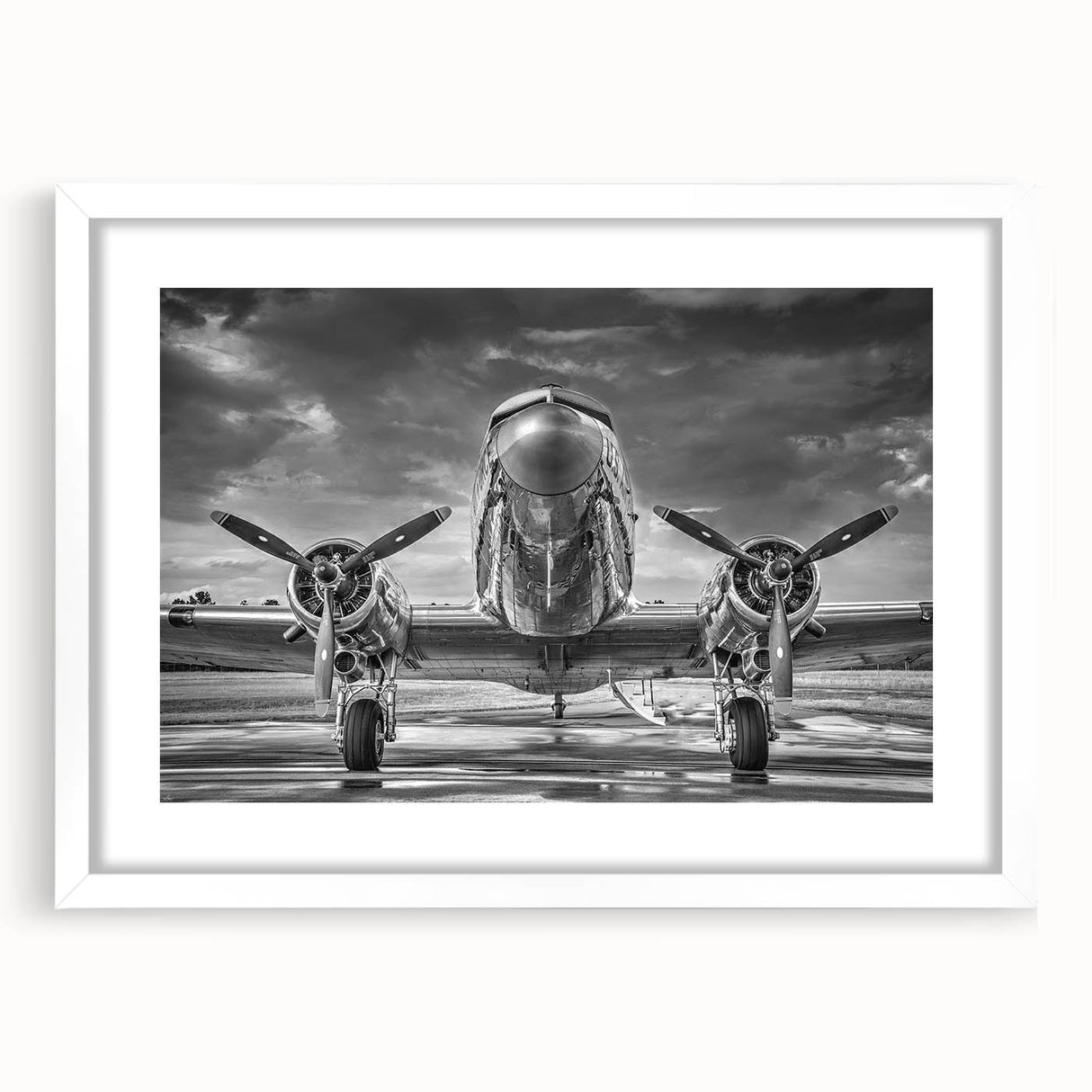 Extra large abstract art print of an airplane, in textured grey and blue tones on a white framed canvas.