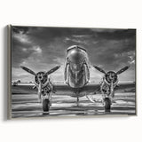 Silver-framed canvas featuring a vintage poster art of a black airplane, ideal for bedroom wall decor.