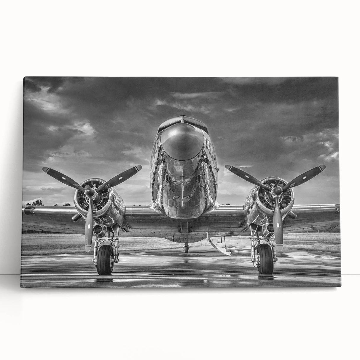 Black and white photograph of a vintage airplane on stretched canvas, ideal for kitchen wall art or bedroom ambiance.