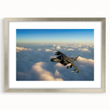 Textured abstract art print of airplanes in muted gray and silver hues, framed with a silver mat.