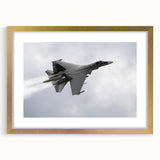Abstract art print of an airplane in muted gray and blue, framed in gold, ideal for bedroom or dining room decor.