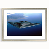 Textured art print of an abstract airplane design in neutral shades, framed in silver, ideal for bedroom wall decor.