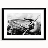 Extra large abstract art print of a colorful airplane, textured design on black-framed canvas, ideal for living room decor.