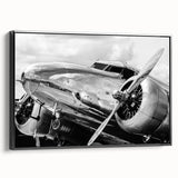Black and white framed canvas featuring a vintage airplane side view, suitable as wall art for a bedroom.