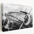 Side view of a vintage airplane in muted gray tones on a stretched canvas, suitable for kitchen wall decor.