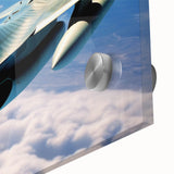 Large abstract wall art of an airplane in flight, rendered in cool blue and gray tones on acrylic glass.