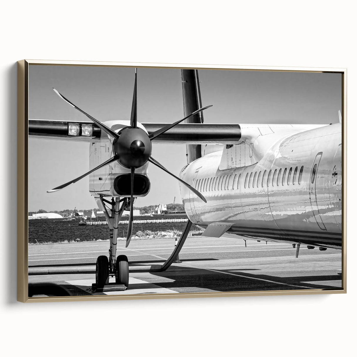 Side view of a vintage airplane in black and gold on a framed canvas, suitable for bedroom wall decor.