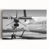 Black and white photograph of an airplane on stretched canvas, ideal for kitchen wall art.