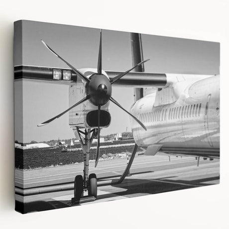 Large art print of an airplane in flight on a stretched canvas, rendered in muted gray and blue tones.