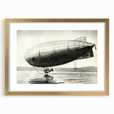 Abstract art print of an airship in muted gold and white tones, framed in gold, suitable for dining room decor.