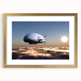 Abstract art print featuring a stylized airship in muted gray and gold tones on a framed canvas.