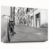 Side view of a large abstract acrylic print featuring a bicycle, in muted gray and blue tones.