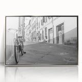 Mid-century modernist art depicting a bicycle in muted earth tones on a silver-framed acrylic print.