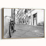 Framed canvas of a vintage bicycle poster in black and gold tones, ideal for bedroom wall art.