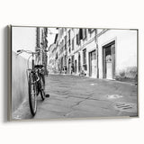Framed canvas featuring a vintage black bicycle on a colorful abstract background, ideal for living room decor.