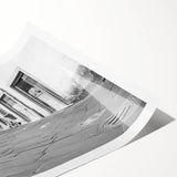 Extra large wall art featuring line art flowers and a bicycle in black and white, printed on rolled canvas.