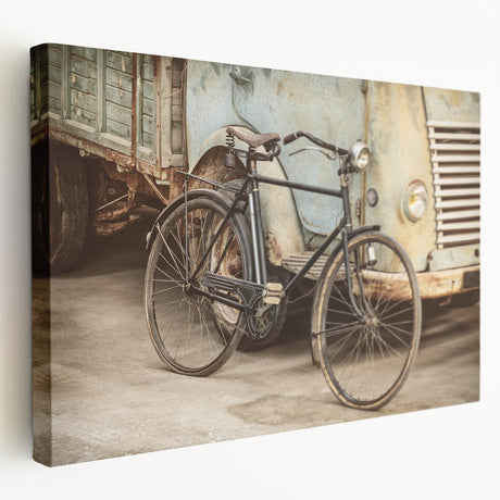 Side view of a large art print featuring a vintage bicycle on stretched canvas, with neutral tones.