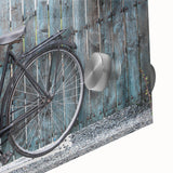 Large abstract bicycle design on acrylic glass in muted earth tones.