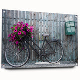 Side view of a large abstract bicycle print on acrylic glass, featuring neutral and blue shades.