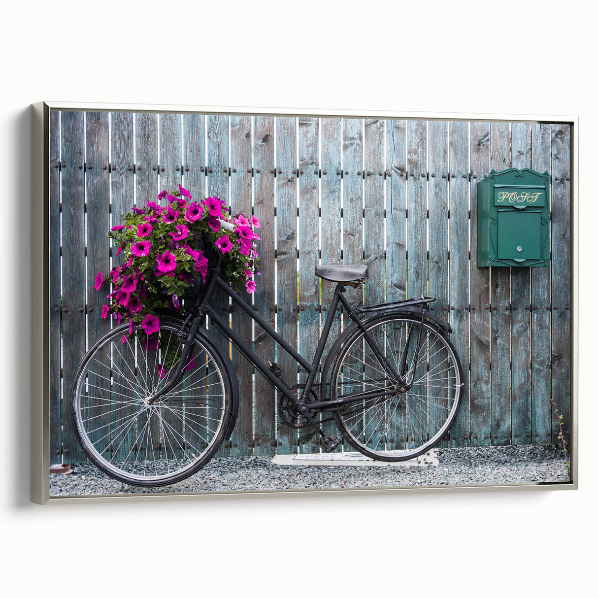Framed canvas of a vintage bicycle in black with colorful accents, ideal for decorating a home office.