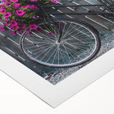 Art deco poster of a vintage bicycle in muted gold and black on a rolled canvas, suitable for dining room decor.