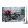 Vintage bicycle with floral basket on muted beige background, rolled print, ideal for art wall dining room.
