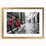 Textured art print of an abstract bicycle design in gold and black, framed with a mat, ideal for bedroom decor.