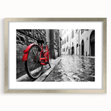 Abstract art print of a bicycle in monochrome shades on a silver-framed mat, suitable for dining room decor.