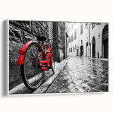 Vintage poster art of a bicycle on a white framed canvas, featuring colorful accents, ideal for living room decor.