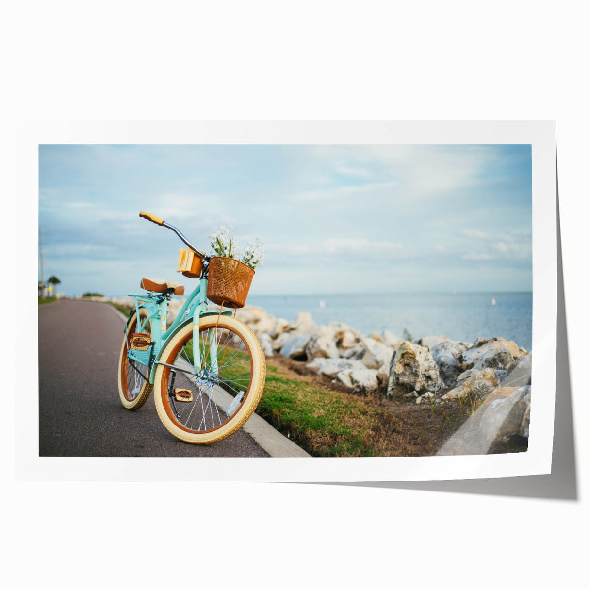 Vintage-style bicycle with floral accents in soft pastel shades, printed on rolled canvas, suitable for dining room wall art.