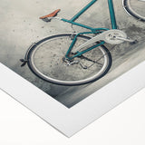 Art deco poster of a vintage bicycle in muted gold and black tones, printed on rolled canvas, suitable for dining room decor.