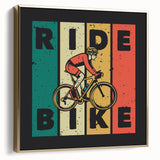 Vintage poster art of a bicycle on a black background with silver and gold accents, framed canvas.